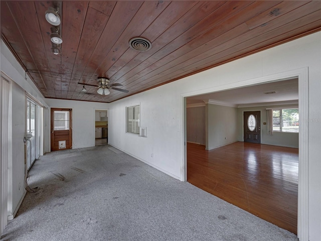 spare room featuring crown molding, ceiling fan, light hardwood / wood-style flooring, and wood ceiling