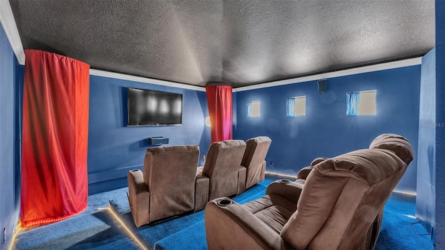 cinema with crown molding, carpet, and a textured ceiling