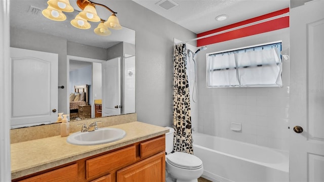 full bathroom featuring a textured ceiling, vanity, toilet, and shower / bathtub combination with curtain