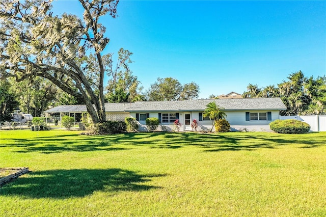 ranch-style house with a front lawn