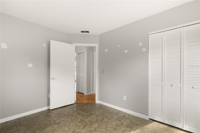 unfurnished bedroom featuring a closet