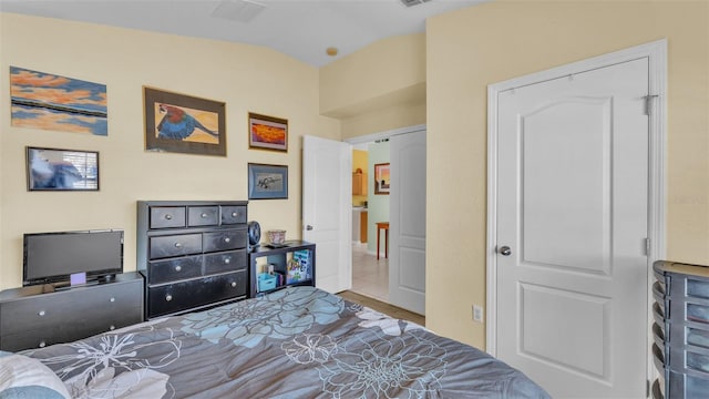 bedroom with vaulted ceiling