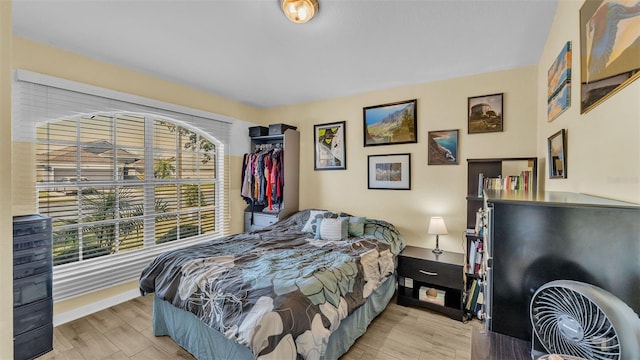 bedroom with light hardwood / wood-style floors