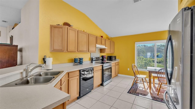 kitchen featuring light brown cabinets, sink, stainless steel appliances, lofted ceiling, and light tile patterned floors