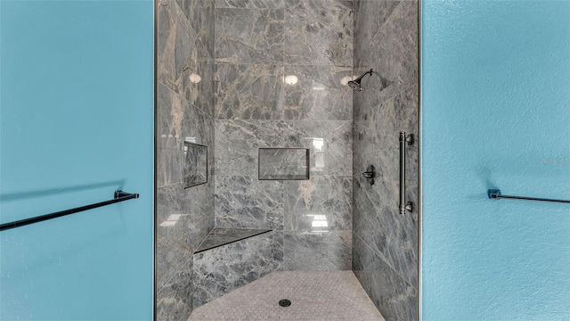 bathroom featuring tiled shower