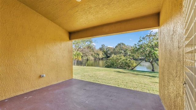 view of patio with a water view