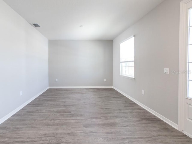 empty room featuring wood-type flooring