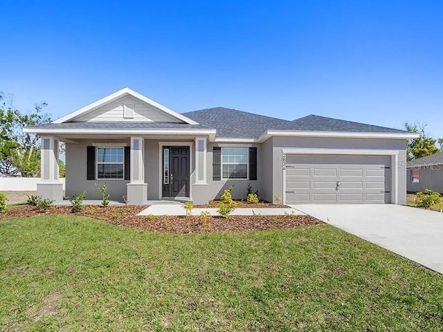 ranch-style home with a porch, concrete driveway, an attached garage, a front yard, and stucco siding