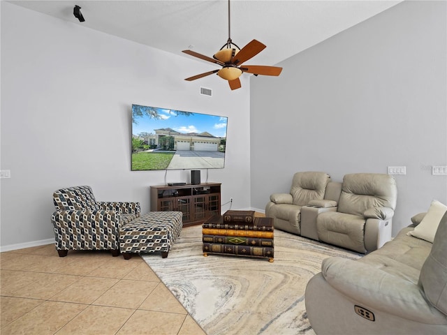 living room featuring high vaulted ceiling, ceiling fan, and light tile patterned flooring