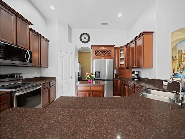 kitchen with sink and appliances with stainless steel finishes