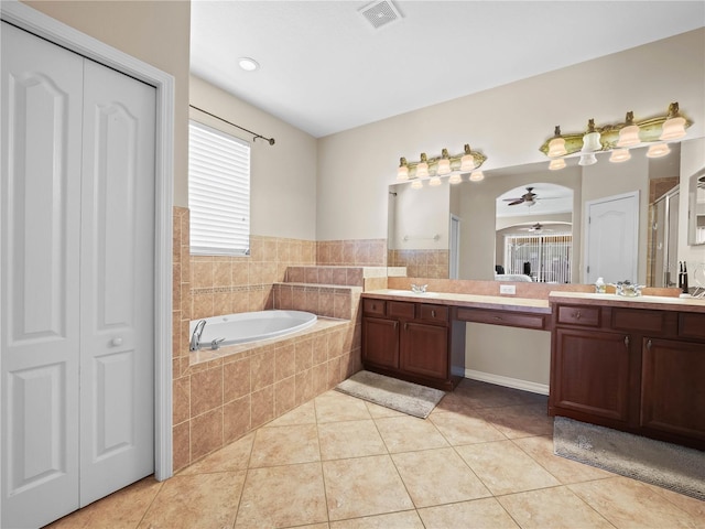 bathroom featuring tile patterned floors, vanity, separate shower and tub, and ceiling fan