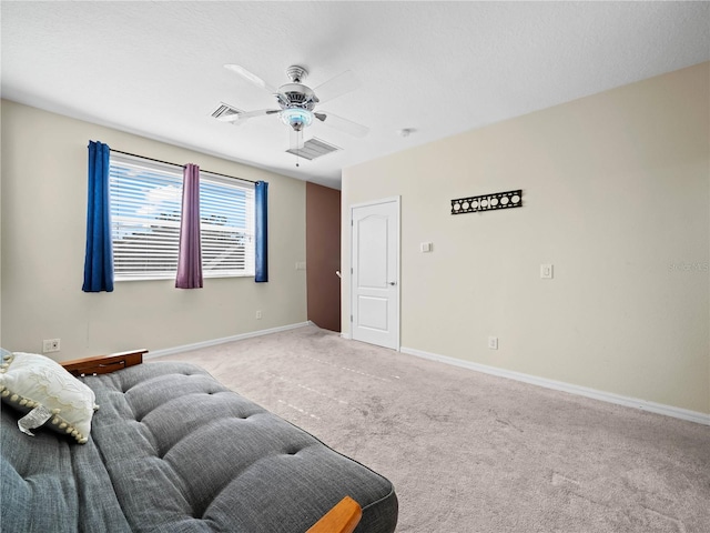 sitting room with carpet floors and ceiling fan