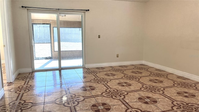 spare room with tile patterned flooring