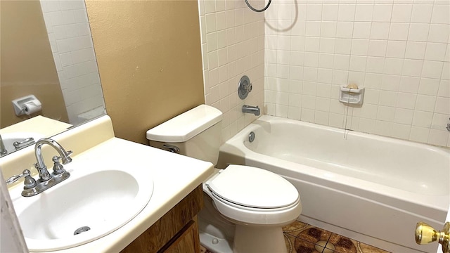 full bathroom featuring tile patterned flooring, vanity, toilet, and tiled shower / bath