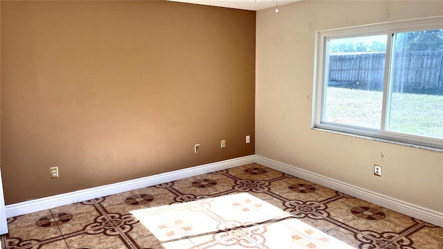 spare room featuring tile patterned flooring