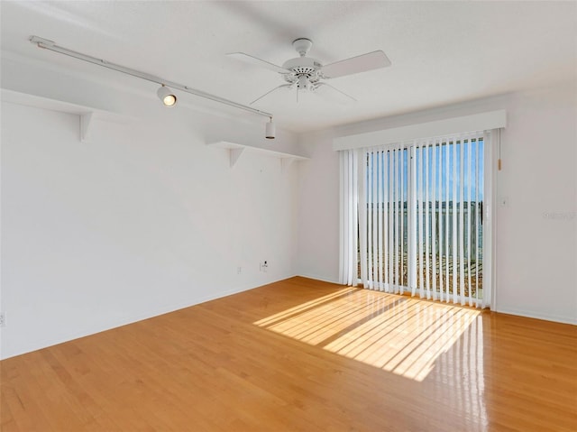 spare room featuring ceiling fan and wood-type flooring