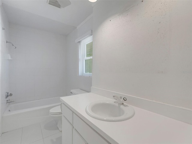 full bathroom featuring tile patterned floors, vanity, toilet, and tiled shower / bath combo