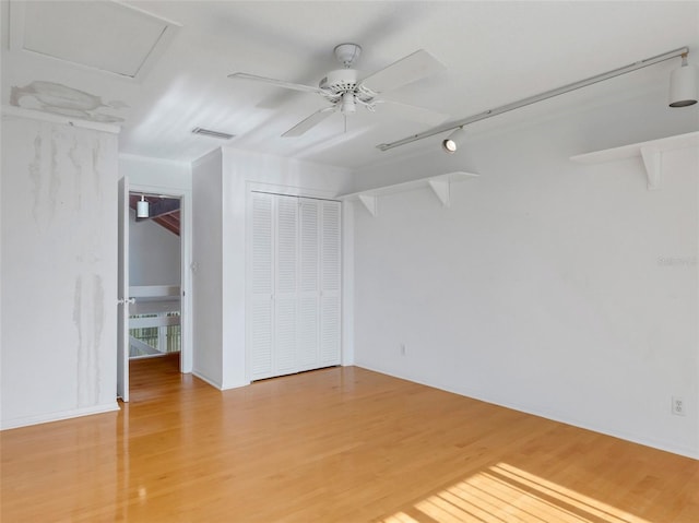 interior space featuring ceiling fan and wood-type flooring