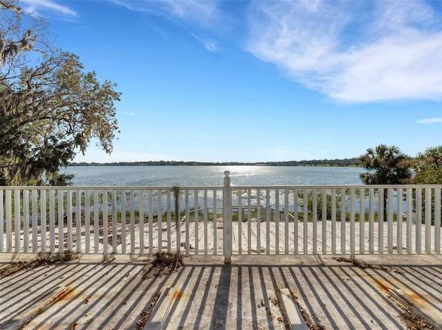 wooden deck with a water view