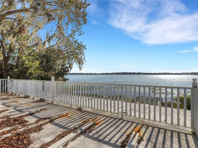 view of patio with a water view