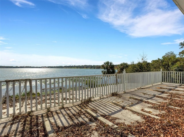 wooden deck featuring a water view