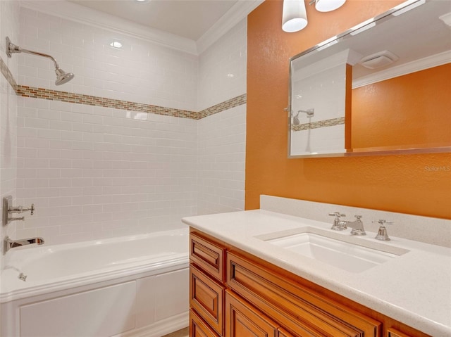 bathroom featuring tiled shower / bath combo, ornamental molding, and vanity