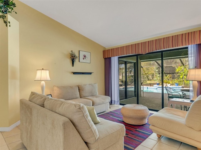 living room featuring light tile patterned floors and lofted ceiling