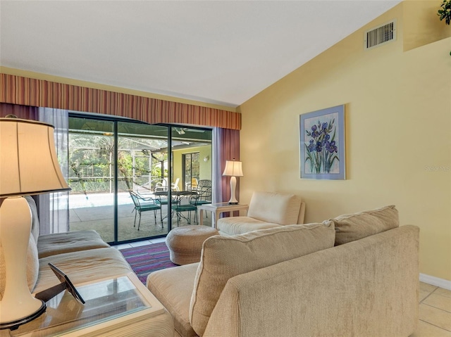 tiled living room featuring lofted ceiling