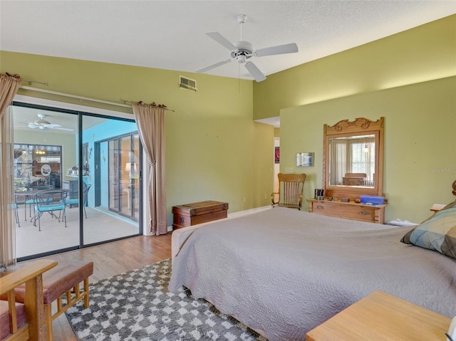 bedroom featuring wood-type flooring, access to outside, and ceiling fan