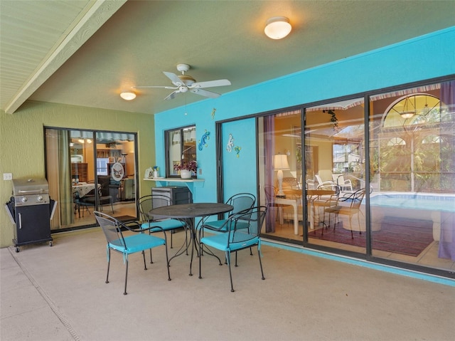 view of patio featuring ceiling fan and area for grilling