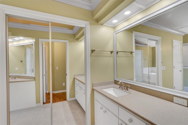 bathroom featuring ornamental molding, recessed lighting, vanity, and tile patterned floors