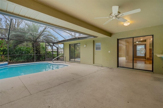 outdoor pool with a lanai, a patio area, and ceiling fan