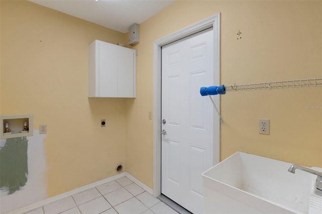 washroom featuring washer hookup, light tile patterned floors, cabinet space, hookup for an electric dryer, and a sink