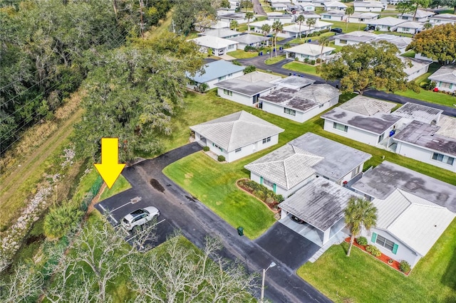 birds eye view of property with a residential view