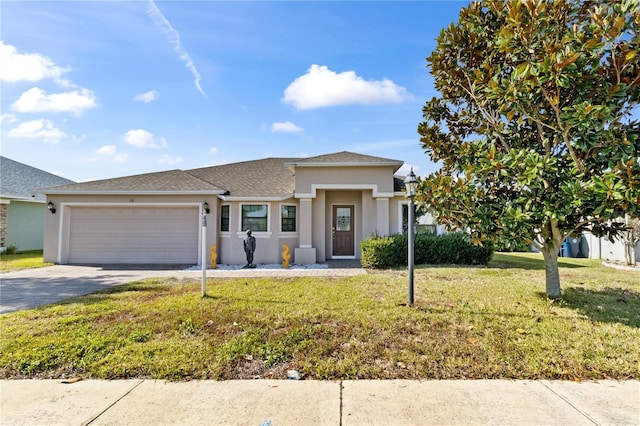 view of front facade featuring a front yard and a garage