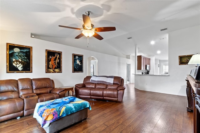 living room with dark hardwood / wood-style flooring, vaulted ceiling, and ceiling fan