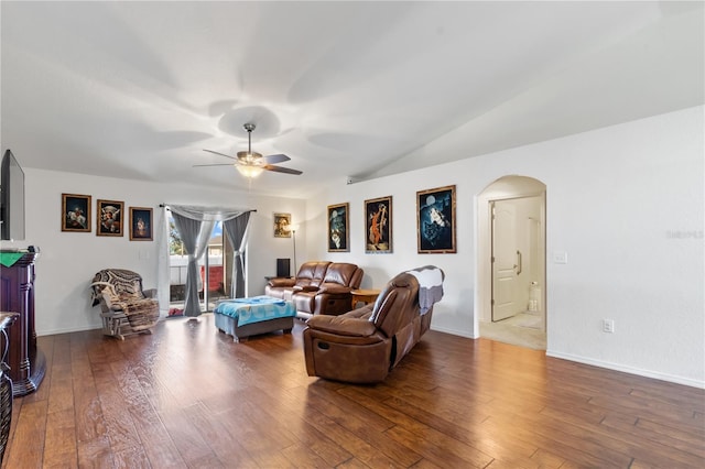 living room with hardwood / wood-style floors, ceiling fan, and lofted ceiling