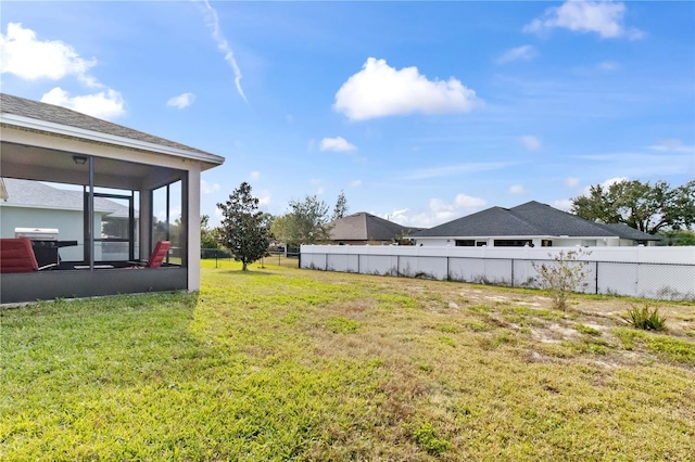 view of yard with a sunroom