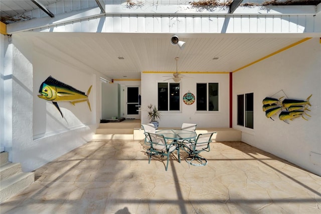 view of patio featuring ceiling fan and outdoor dining area