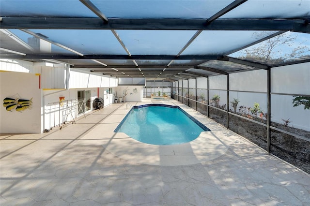 pool with a lanai and a patio