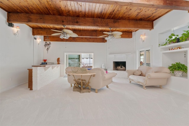 carpeted living area featuring wooden ceiling, a wealth of natural light, and a ceiling fan