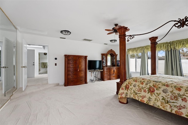 bedroom with visible vents and carpet flooring