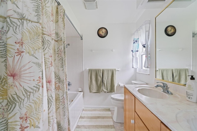 bathroom with visible vents, vanity, toilet, and shower / bath combo with shower curtain