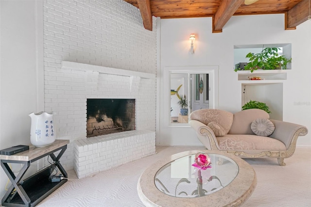 living room with carpet, wood ceiling, a fireplace, and beam ceiling