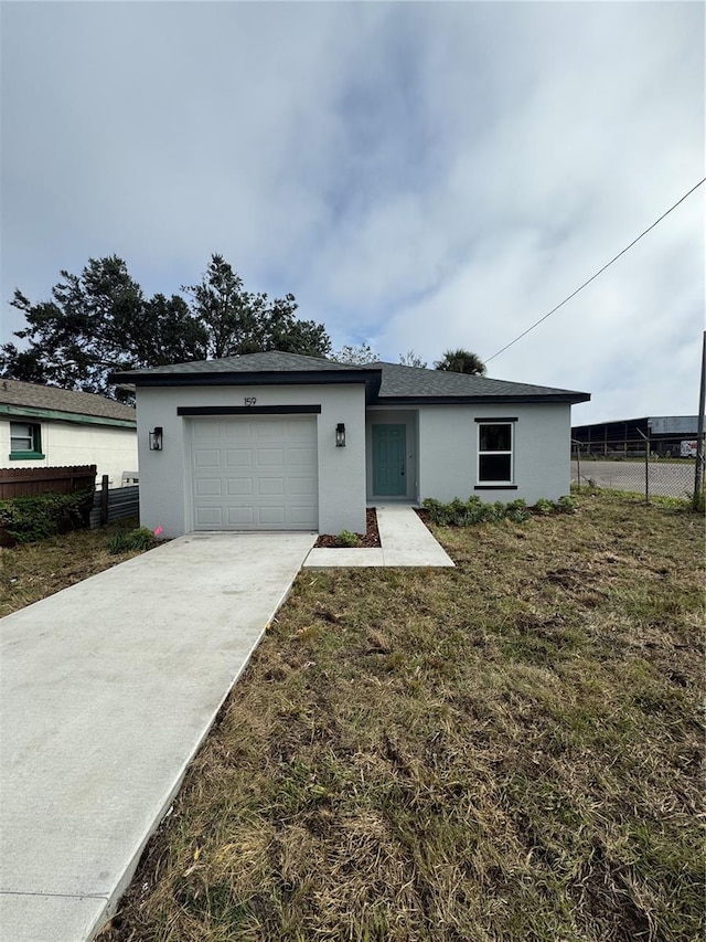 ranch-style house with a front lawn and a garage