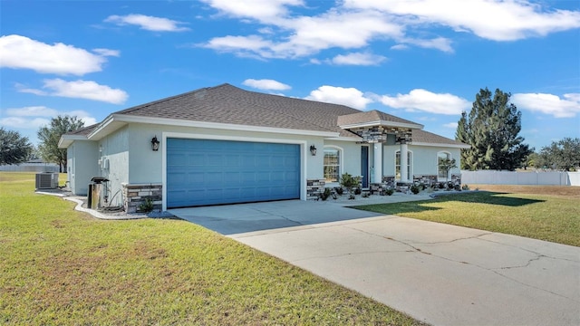 ranch-style house with a garage, a front lawn, and cooling unit