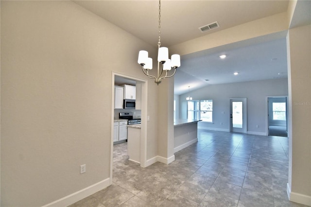 interior space featuring a chandelier and vaulted ceiling