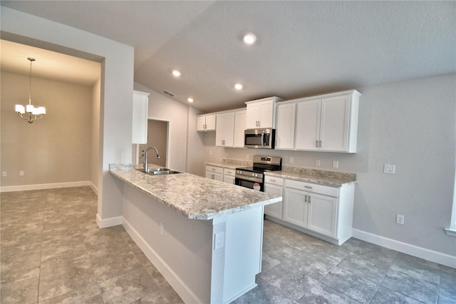 kitchen featuring lofted ceiling, sink, white cabinetry, hanging light fixtures, and appliances with stainless steel finishes