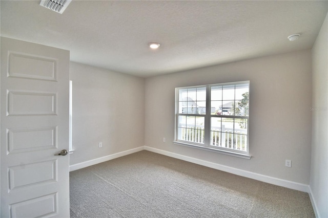 empty room featuring carpet floors