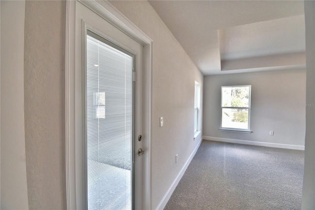 doorway with carpet flooring